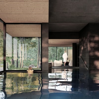 Piscine intérieure du Strøm Spa à Saint-Sauveur, caractérisée par son design moderne, ses matériaux sombres et sa grande fenestration donnant sur la forêt.